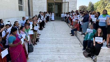 Silent civil society demonstration at the entrance of the plenary venue of the negotiations at the UN Assembly Hall, Palais des Nations, Geneva, where delegates had to pass to gain access. UN security rules do not allow demonstrations and the use of logos and/or flags on UN premises or quote/single out specific countries. Photo: IPEN