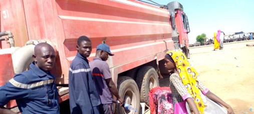Fire brigade workers provide drinkable water to the displaced camp. Photo: SYNACOT