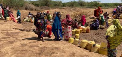 Women and girls lining up for water due to water shortage as a result of droughts in Kenya