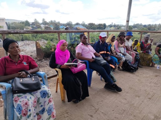 Dumpsite workers workshop listening to the facilitator.